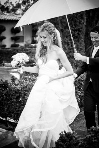 bride with groom and umbrella black and white